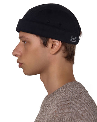 model-wearing-undercontrol-washed-brimless-cap-black-photo