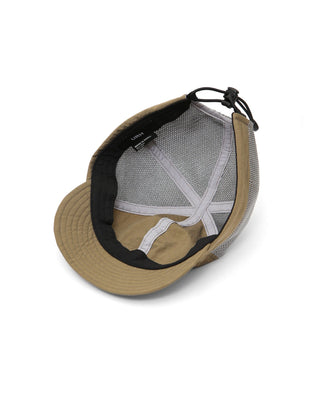 Baseball cap with short visor in outdoor setting