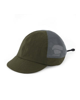 Baseball cap with short visor in outdoor setting