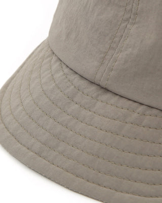 Sun-protective cap worn during hiking