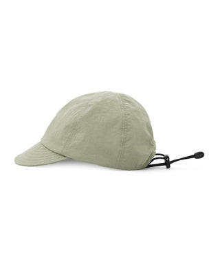 Baseball cap with short visor in outdoor setting