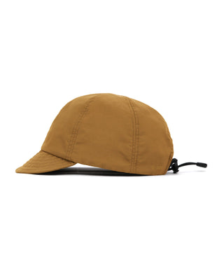 Baseball cap with short visor in outdoor setting