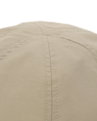 Baseball cap with short visor in outdoor setting