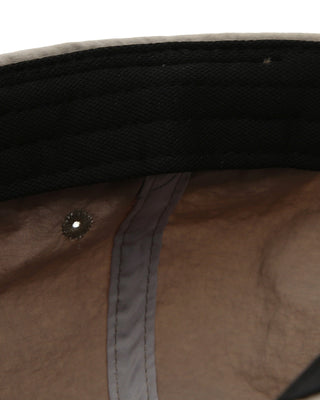 Side view of a flat visor cap showing its structure.