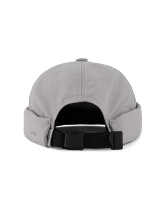 Adjustable brimless cap on a mountain peak