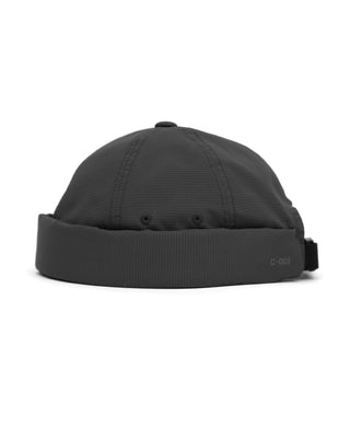 Adjustable brimless cap on a mountain peak