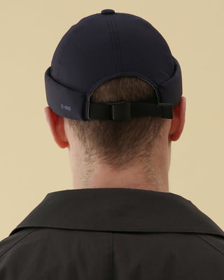 Adjustable brimless cap on a mountain peak