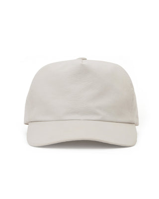 Curved visor cap emphasizing a sporty look.