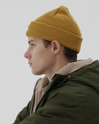 A model wearing a fisherman beanie