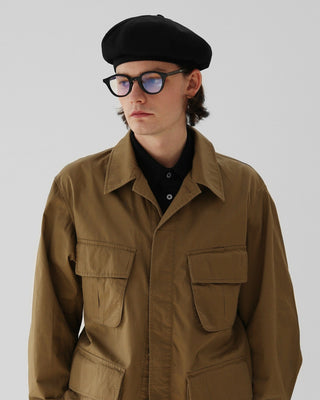 A classic newsboy cap, perfect for a vintage-inspired look.