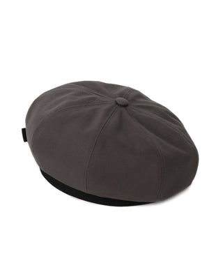 A French artist beret in a minimalist, modern setting.