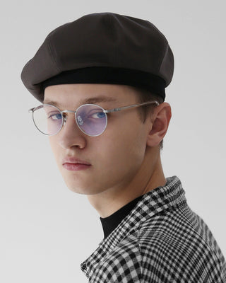 A close-up of detailed stitching on a quality beret.