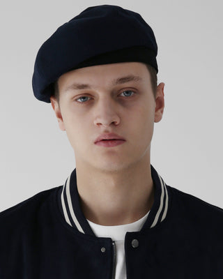 A French artist beret in a minimalist, modern setting.