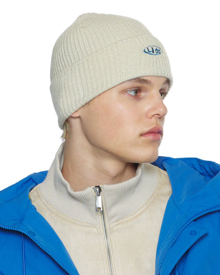 Loose fit beanie on a city street model