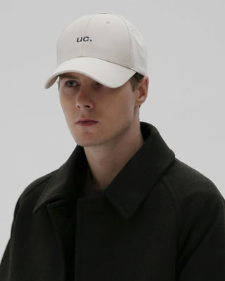 A stylish cap featuring an extended visor for added sun protection.