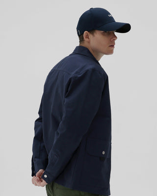 A cap with an elongated visor, adding a touch of style.