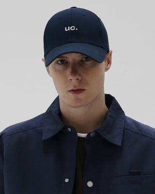 A structured cap with a firm top, offering a distinct style.