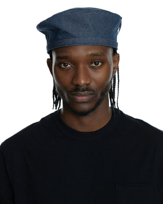 A collection of berets in various colors and styles.