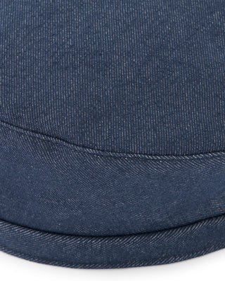 A traditional hunting cap with ear flaps in a neutral tone.