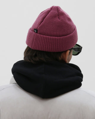 Model showcasing different beanie styles