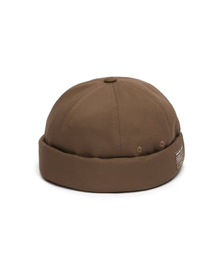 Brimless cap worn by an adventurer